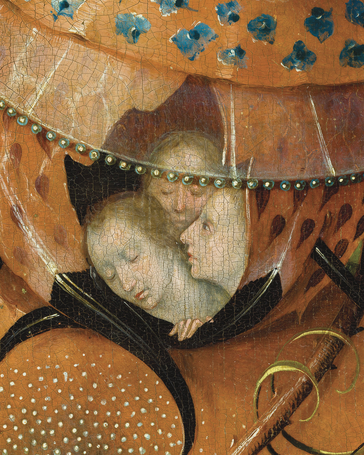 Close-up detail of a painted scene showing two pale faces under a large orange canopy with blue decorative motifs and black trim.