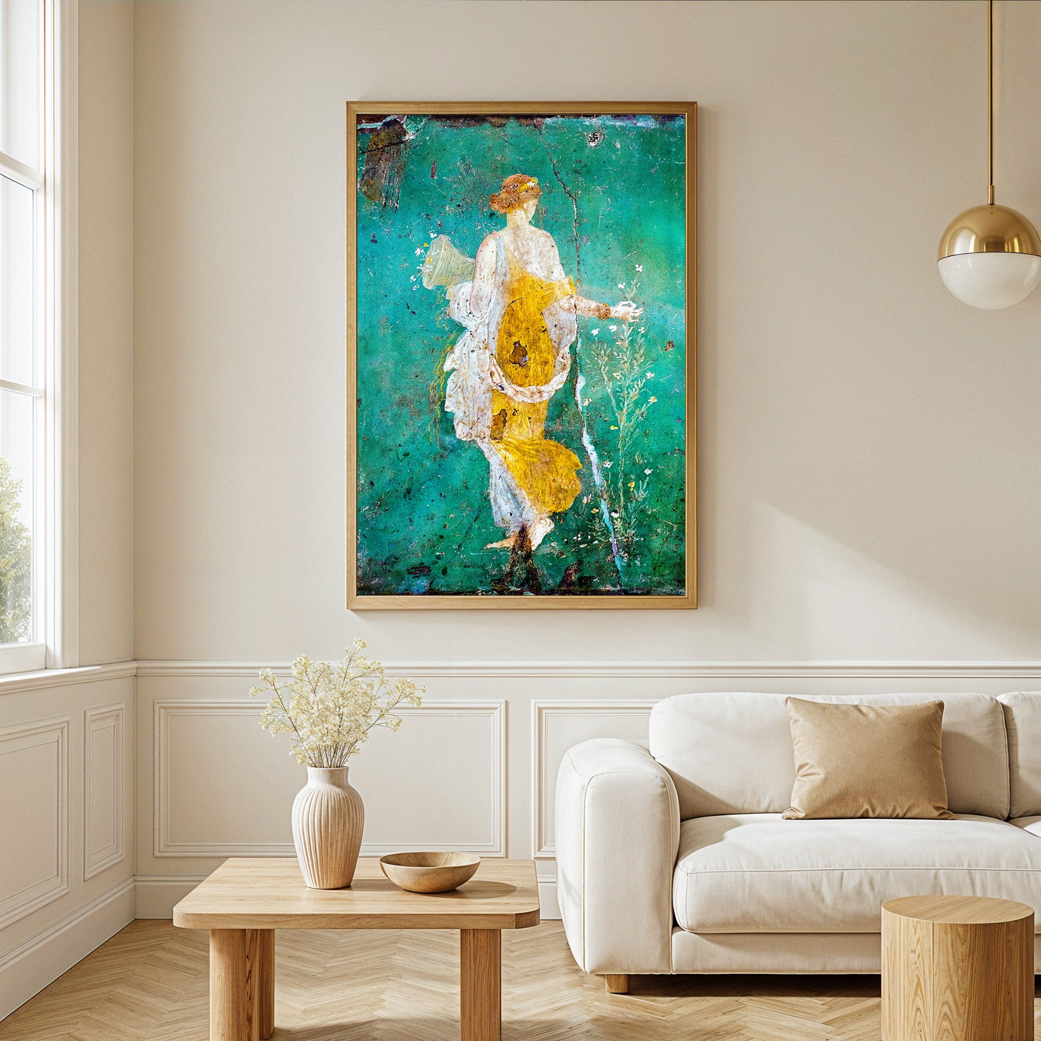 Framed abstract artwork in a living room with a white sofa and wooden coffee table.