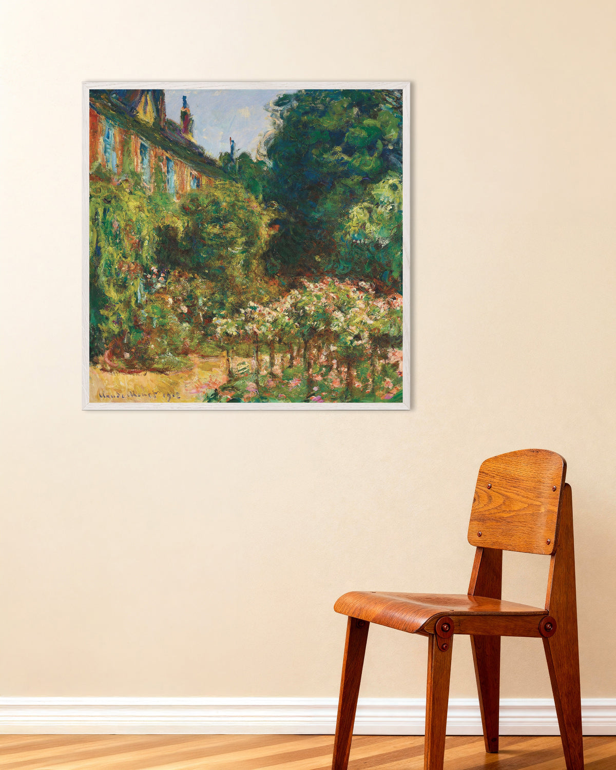 Poster Das Haus des Künstlers in Giverny (1912) von Claude Monet mit weißem Holzrahmen